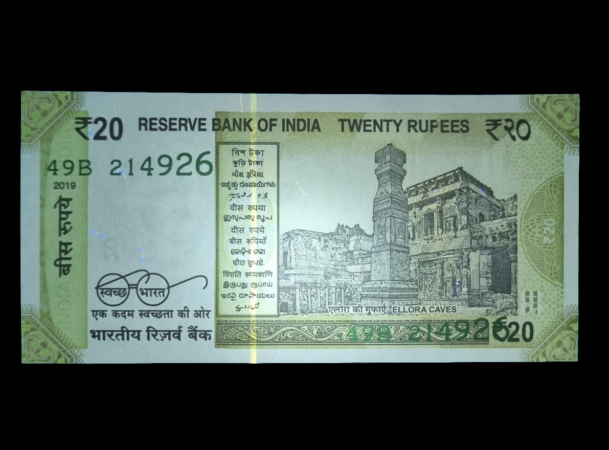ERROR India 20 rupee UNC bill serial number printed back side error.